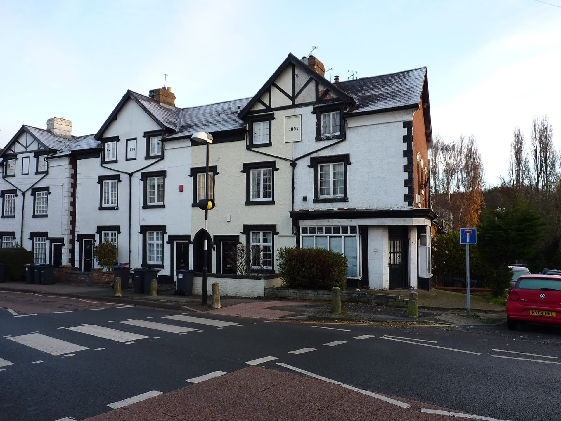 Black-and-white painted houses with gables at 99 to 105 Northfield Road, Harborne
