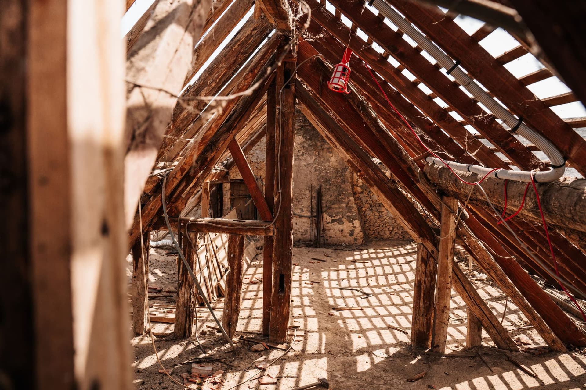 Old cut-timber rafters and purlins in an unconverted loft