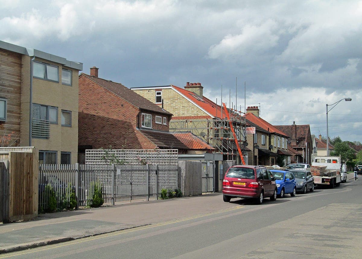 Scaffolding up on a row of houses on Coleridge Road, Cambridge, while a loft conversion is built
