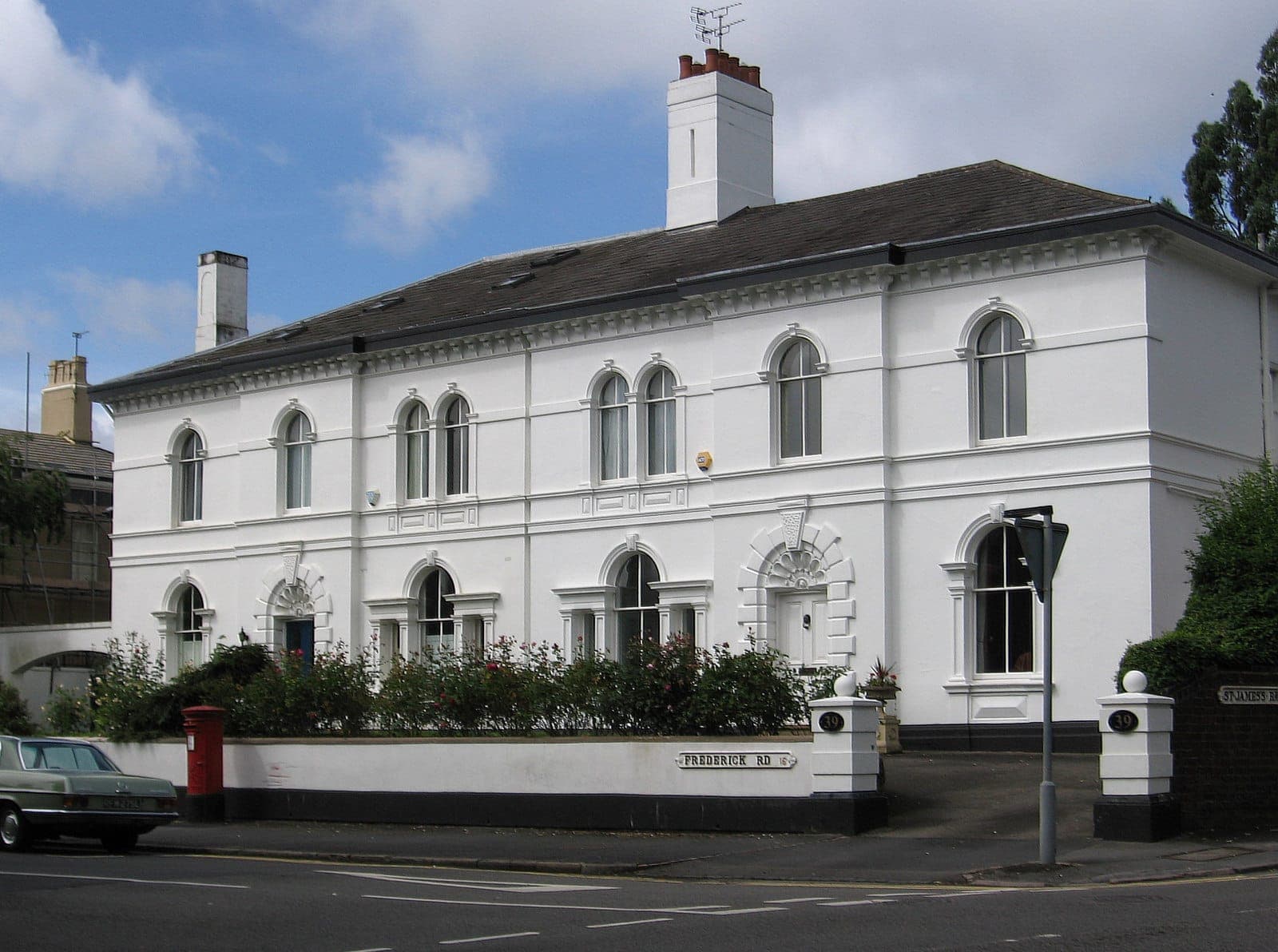 White stucco villas with slate roofs and chimneys on Frederick Road, Edgbaston